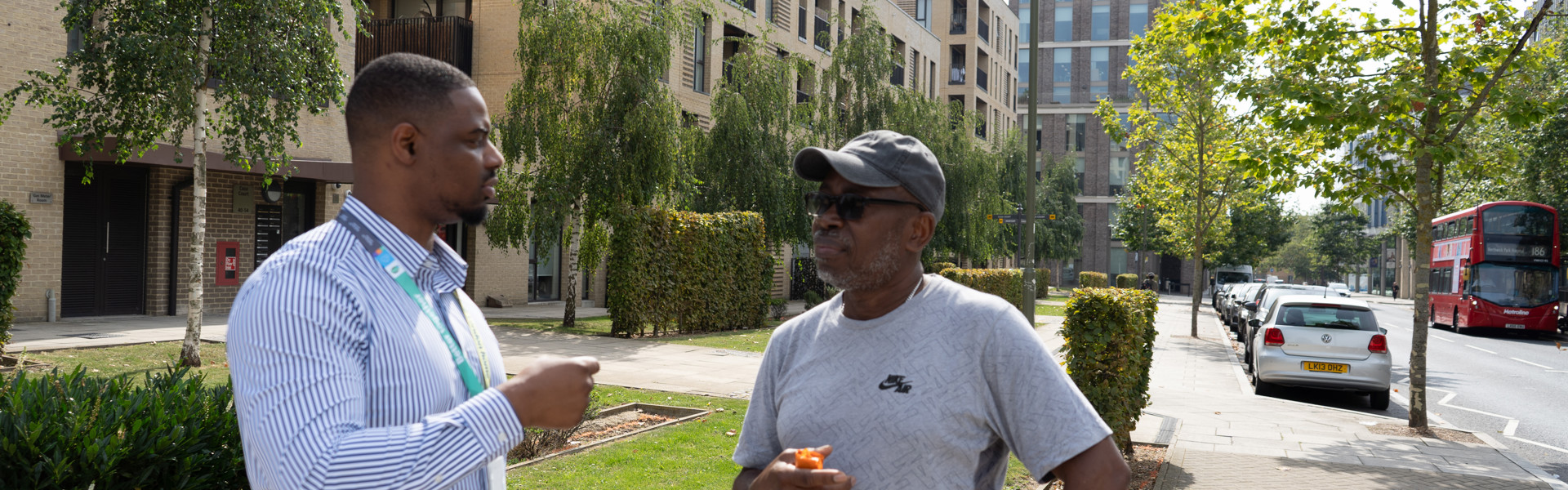 A housing officer chats to a resident.