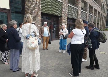 A group of residents standing on a street.