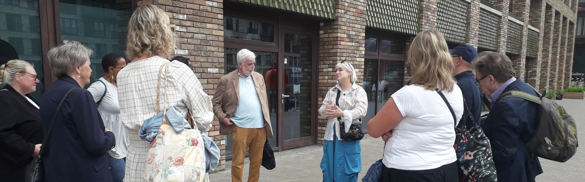 A group of residents standing on a street.