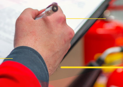 A colleague carrying out Fire Risk Assessments