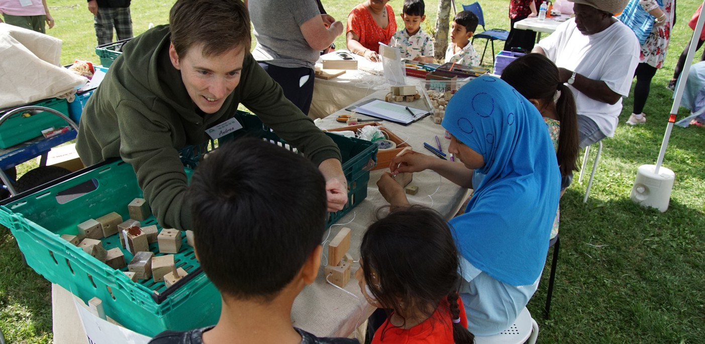 A stallholder chats to residents