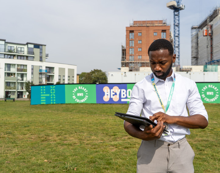 A housing officer visiting a housing estate. 
